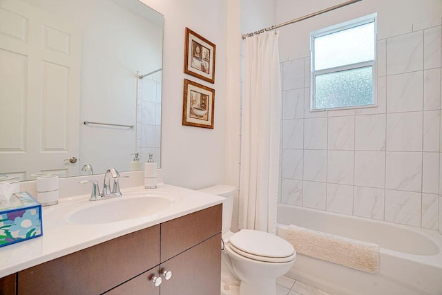 full bathroom with tile patterned floors, vanity, toilet, and shower / bath combo with shower curtain