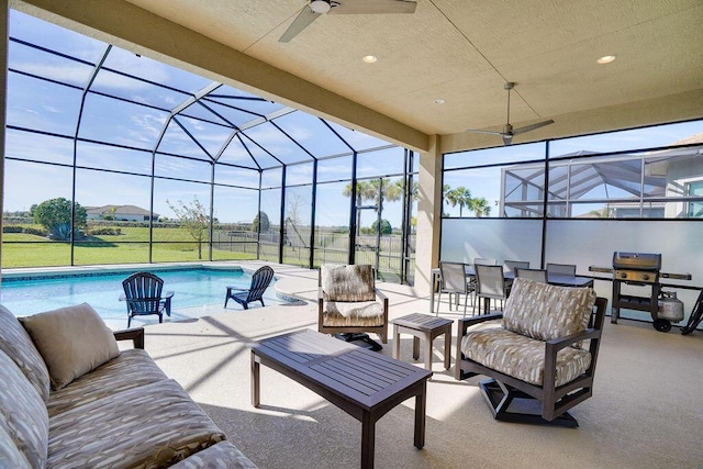 view of patio / terrace featuring an outdoor hangout area and glass enclosure