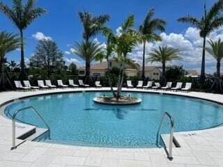 view of swimming pool featuring a patio area