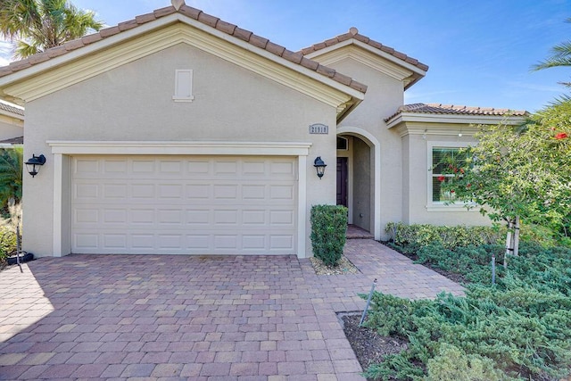 mediterranean / spanish-style home featuring a garage