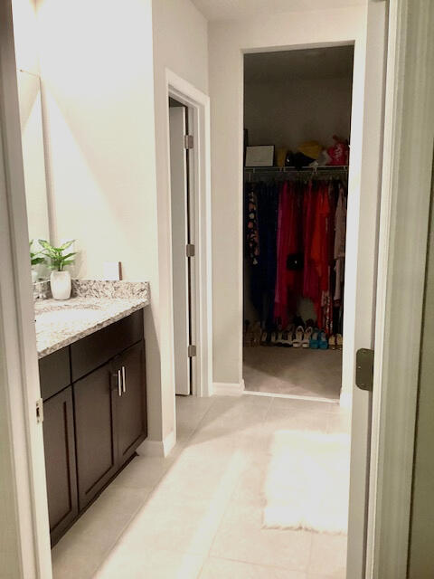 bathroom with tile patterned flooring and vanity