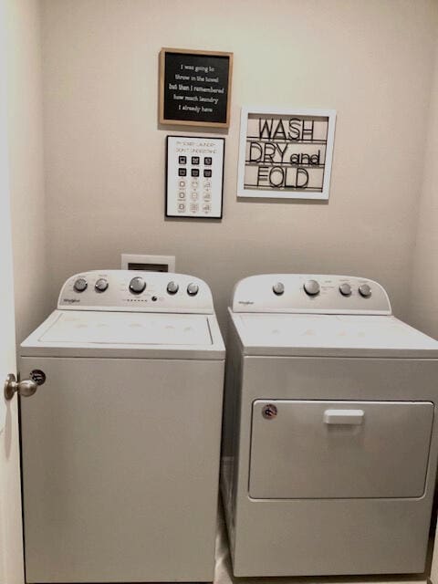 laundry area with separate washer and dryer