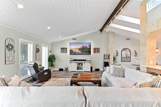 living room with lofted ceiling with beams, hardwood / wood-style floors, and wooden ceiling