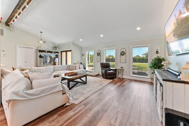 living room with lofted ceiling, rail lighting, light hardwood / wood-style flooring, and wooden ceiling