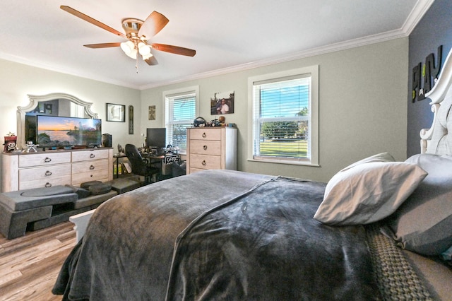 bedroom featuring ceiling fan, ornamental molding, and light hardwood / wood-style flooring