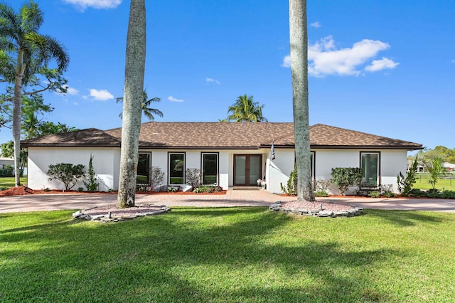 single story home featuring french doors and a front yard