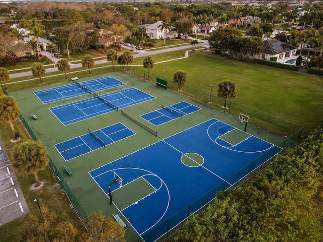 view of sport court featuring a yard and tennis court