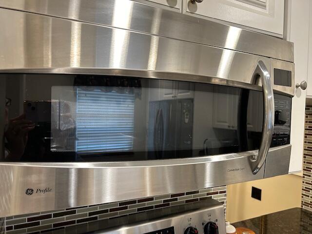 interior details with wall oven and backsplash