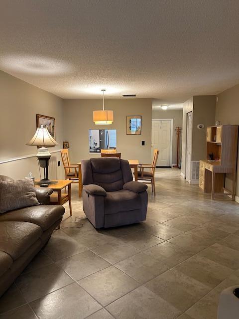 living room featuring a textured ceiling