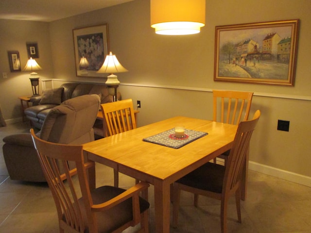 dining room with tile patterned flooring