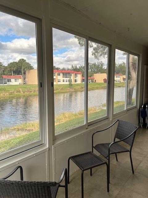 sunroom with a water view