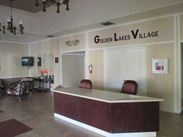 reception area featuring an inviting chandelier