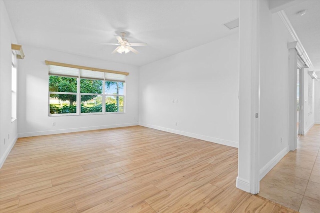 9716 SW Chestwood Ave, Port Saint Lucie, FL 34987 - empty room with baseboards, light wood-type flooring, and a ceiling fan