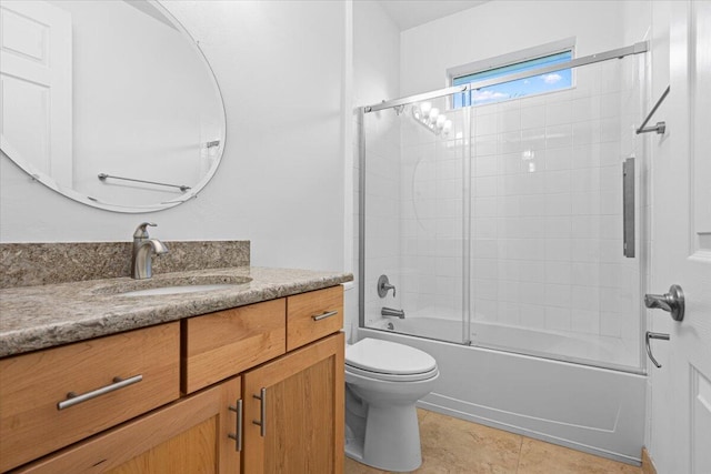 9716 SW Chestwood Ave, Port Saint Lucie, FL 34987 - bathroom featuring tile patterned flooring, toilet, vanity, and shower / bath combination with glass door