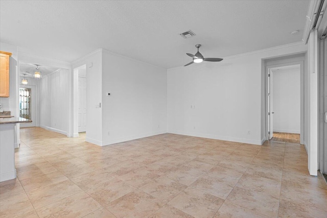 unfurnished living room with ceiling fan and ornamental molding