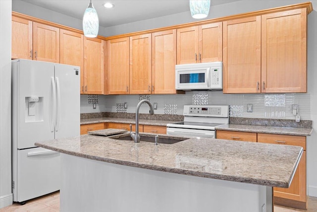 9716 SW Chestwood Ave, Port Saint Lucie, FL 34987 - kitchen featuring a sink, decorative backsplash, an island with sink, and white appliances