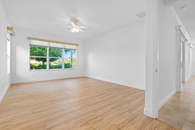 unfurnished room with ceiling fan and light wood-type flooring