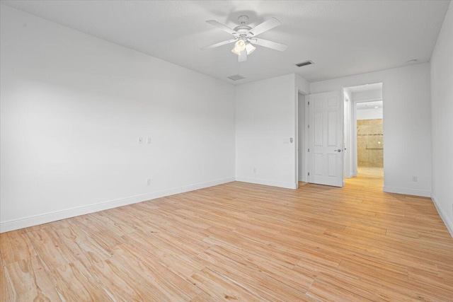 unfurnished room with ceiling fan and light hardwood / wood-style floors