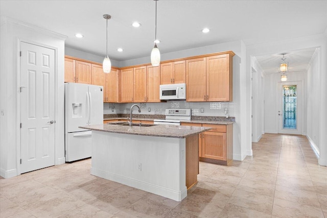 9716 SW Chestwood Ave, Port Saint Lucie, FL 34987 - kitchen featuring tasteful backsplash, a sink, white appliances, a center island with sink, and light stone countertops