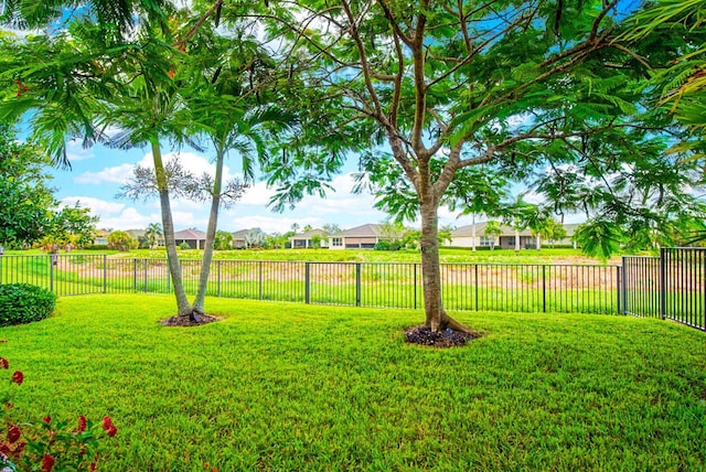 9716 SW Chestwood Ave, Port Saint Lucie, FL 34987 - view of yard featuring a residential view and a fenced backyard