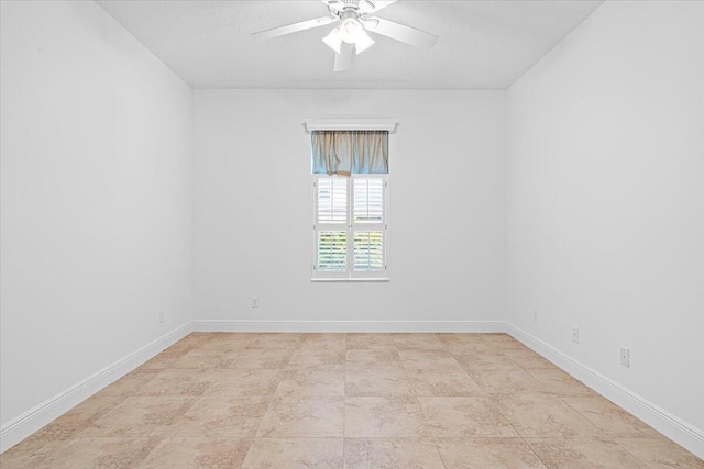 9716 SW Chestwood Ave, Port Saint Lucie, FL 34987 - spare room with baseboards and a ceiling fan