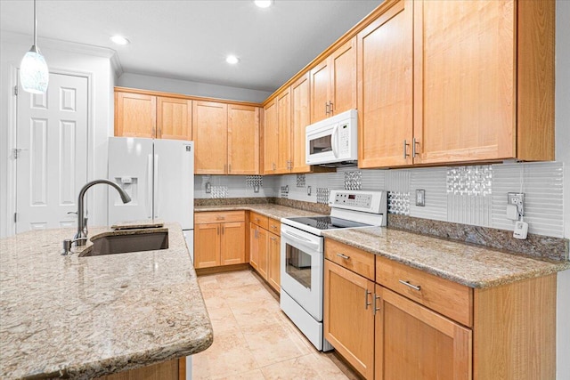 9716 SW Chestwood Ave, Port Saint Lucie, FL 34987 - kitchen with tasteful backsplash, light stone counters, white appliances, decorative light fixtures, and a sink