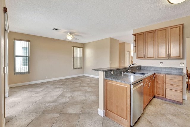 kitchen with kitchen peninsula, dishwasher, sink, and ceiling fan