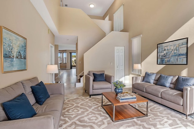 living room with a towering ceiling