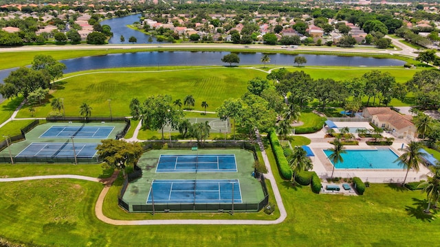 birds eye view of property with a water view