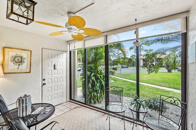 sunroom / solarium with ceiling fan