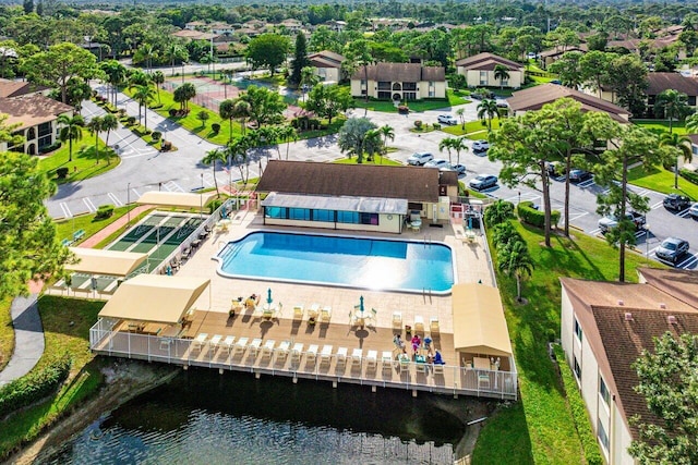 birds eye view of property with a water view