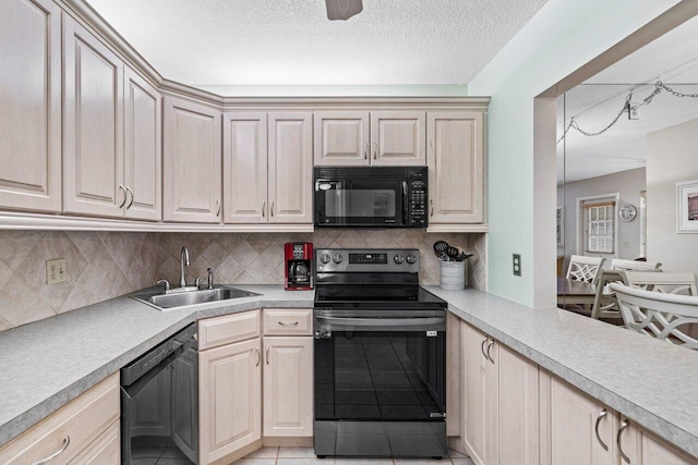 kitchen featuring sink, light tile patterned floors, black appliances, a textured ceiling, and decorative backsplash