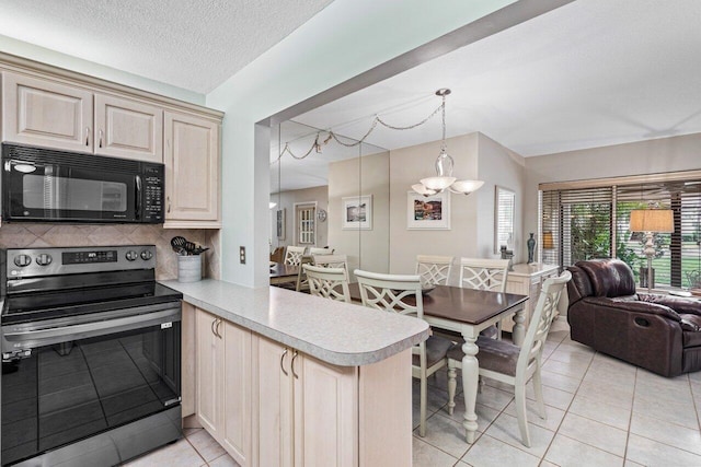 kitchen featuring light tile patterned flooring, pendant lighting, black appliances, kitchen peninsula, and a textured ceiling