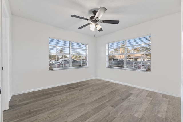 spare room featuring ceiling fan and hardwood / wood-style floors