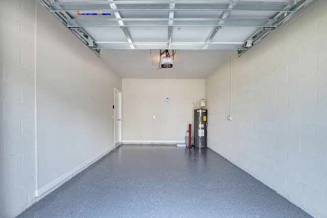 garage featuring electric water heater and a garage door opener