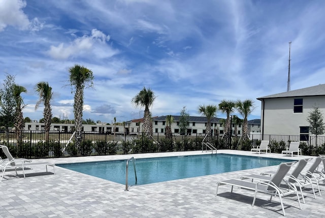 view of swimming pool with a patio area