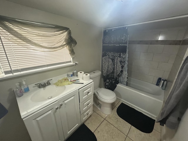 full bathroom with toilet, vanity, tile patterned floors, and shower / bath combo with shower curtain