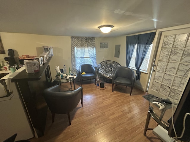 sitting room with wood-type flooring and electric panel