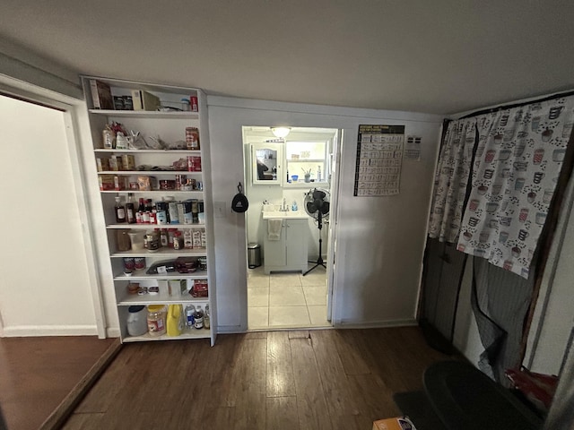 interior space featuring sink and wood-type flooring