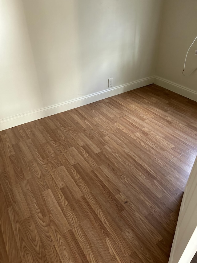 spare room with light hardwood / wood-style flooring