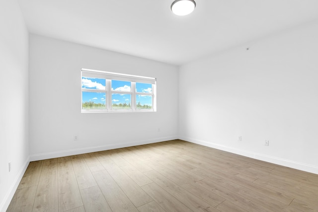 empty room with light hardwood / wood-style floors