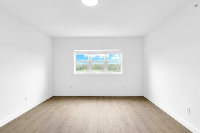 spare room with light hardwood / wood-style floors