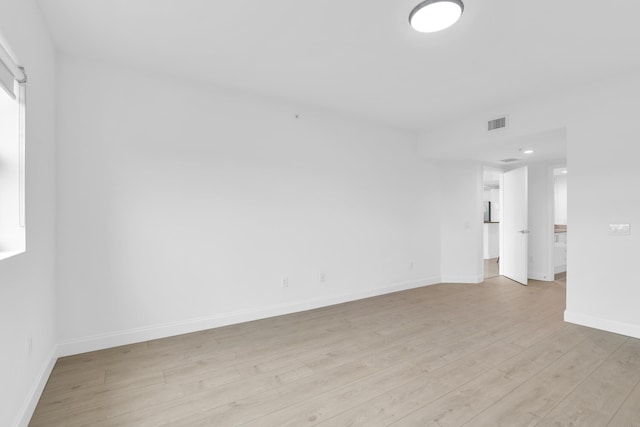 spare room featuring light hardwood / wood-style flooring