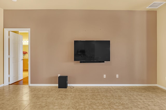 unfurnished living room with light tile patterned floors