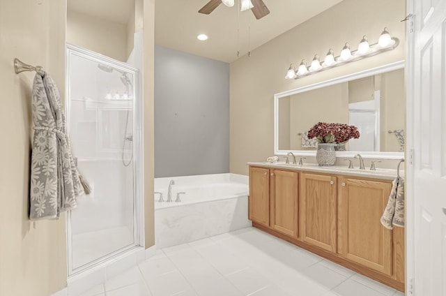 bathroom featuring ceiling fan, plus walk in shower, vanity, and tile patterned flooring