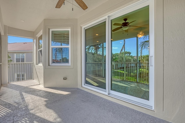 exterior space featuring ceiling fan