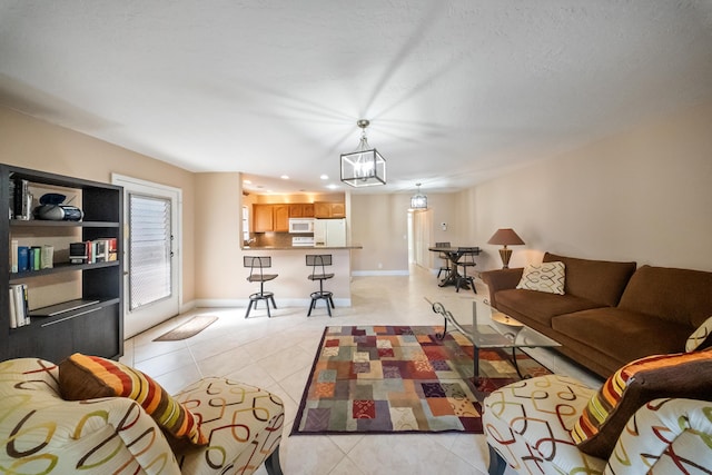 tiled living room with a chandelier