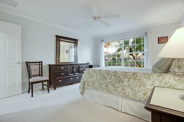 bedroom with ceiling fan, light colored carpet, and crown molding