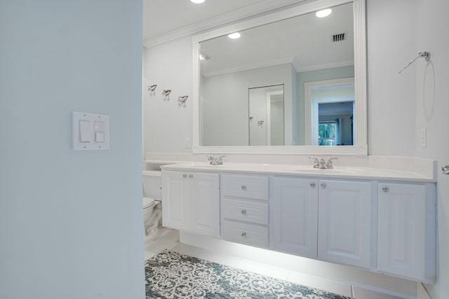 bathroom with vanity, toilet, and crown molding