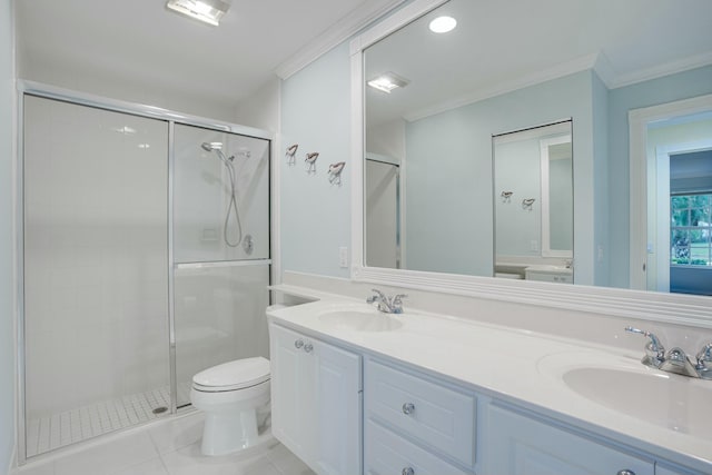 bathroom with tile patterned floors, crown molding, toilet, vanity, and a shower with shower door